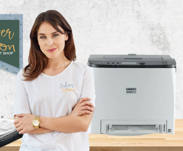 women standing in front of printer